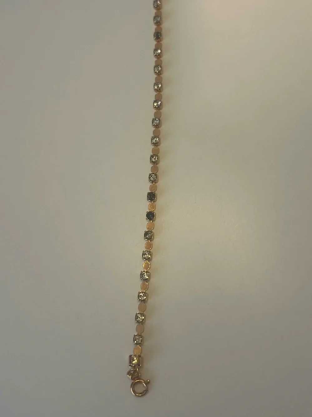 Gold-Tone Crystal Tennis Bracelet - Elegant Women's Jewelry Black and White.